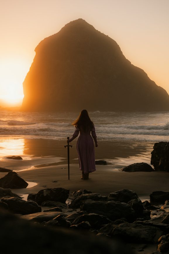 woman on beach with sword